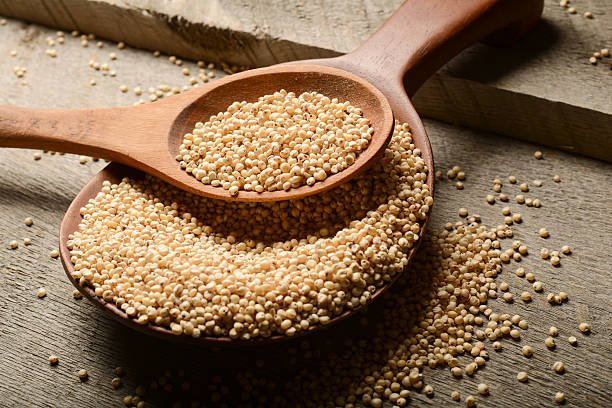 Sorghum Grains on Wood Background